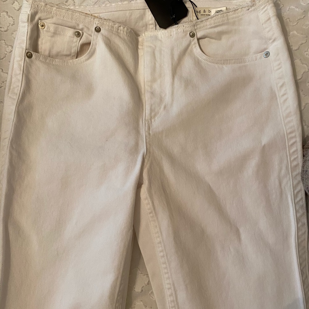 Rag and bone white jeans w slight slit on bottom